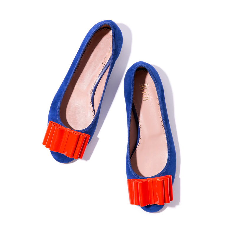 Blue suede ballet flats with orange bow