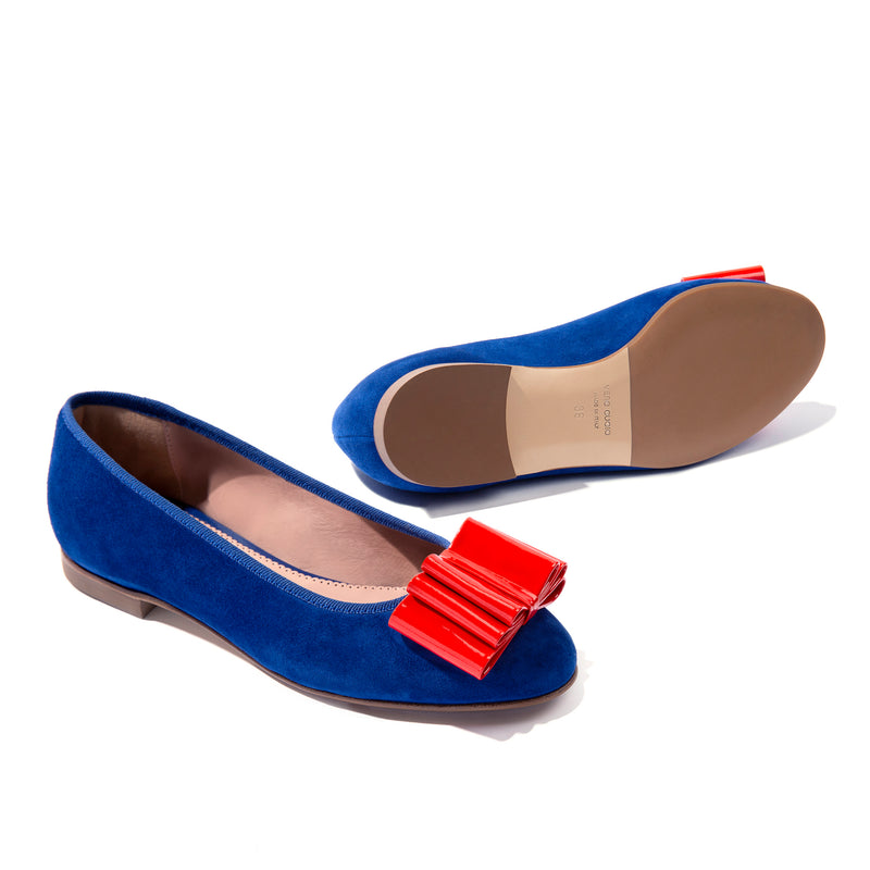 Blue suede ballet flats with orange bow